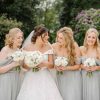 Dove Light Grey Bridesmaids Dresses with White rose ranunculus bouquets