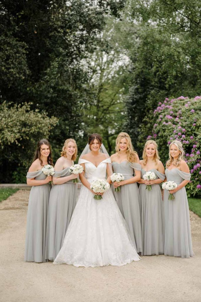 Dove grey bridesmaids dresses white bouquets