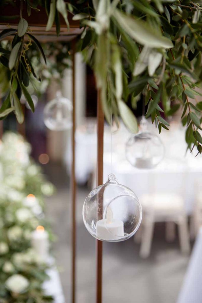 Hanging tealights from tall centrepieces