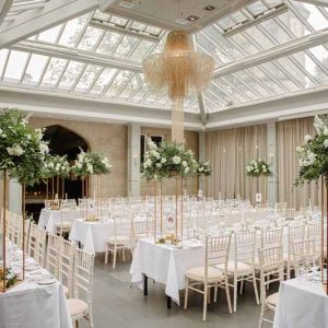 Passion for Flowers Hampton Manor wedding florist tall centrepieces