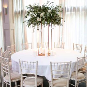 Tall wedding centrepieces floral stands white green