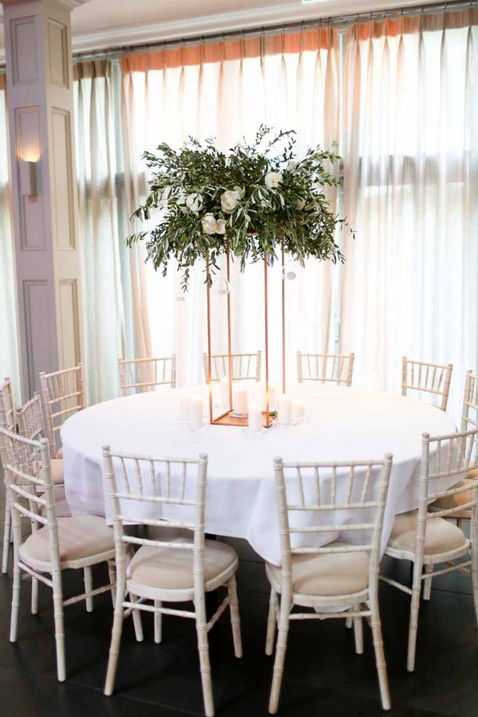 Tall wedding centrepieces floral stands white green