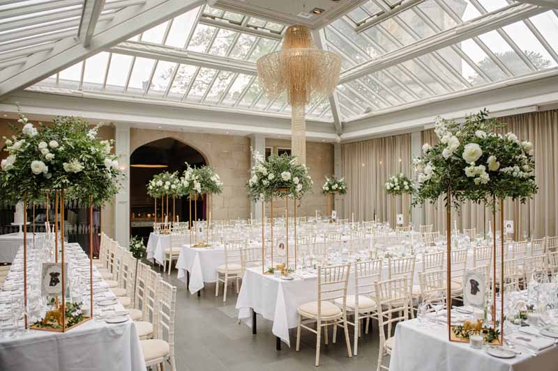 Tall wedding centrepiece ideas Hampton Manor gold stands