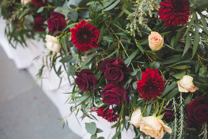 Winter wedding flowers deep red tones